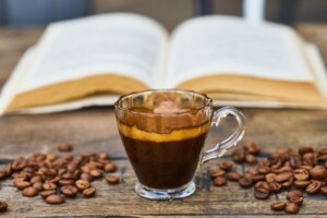 clear glass teacup with coffee beverage